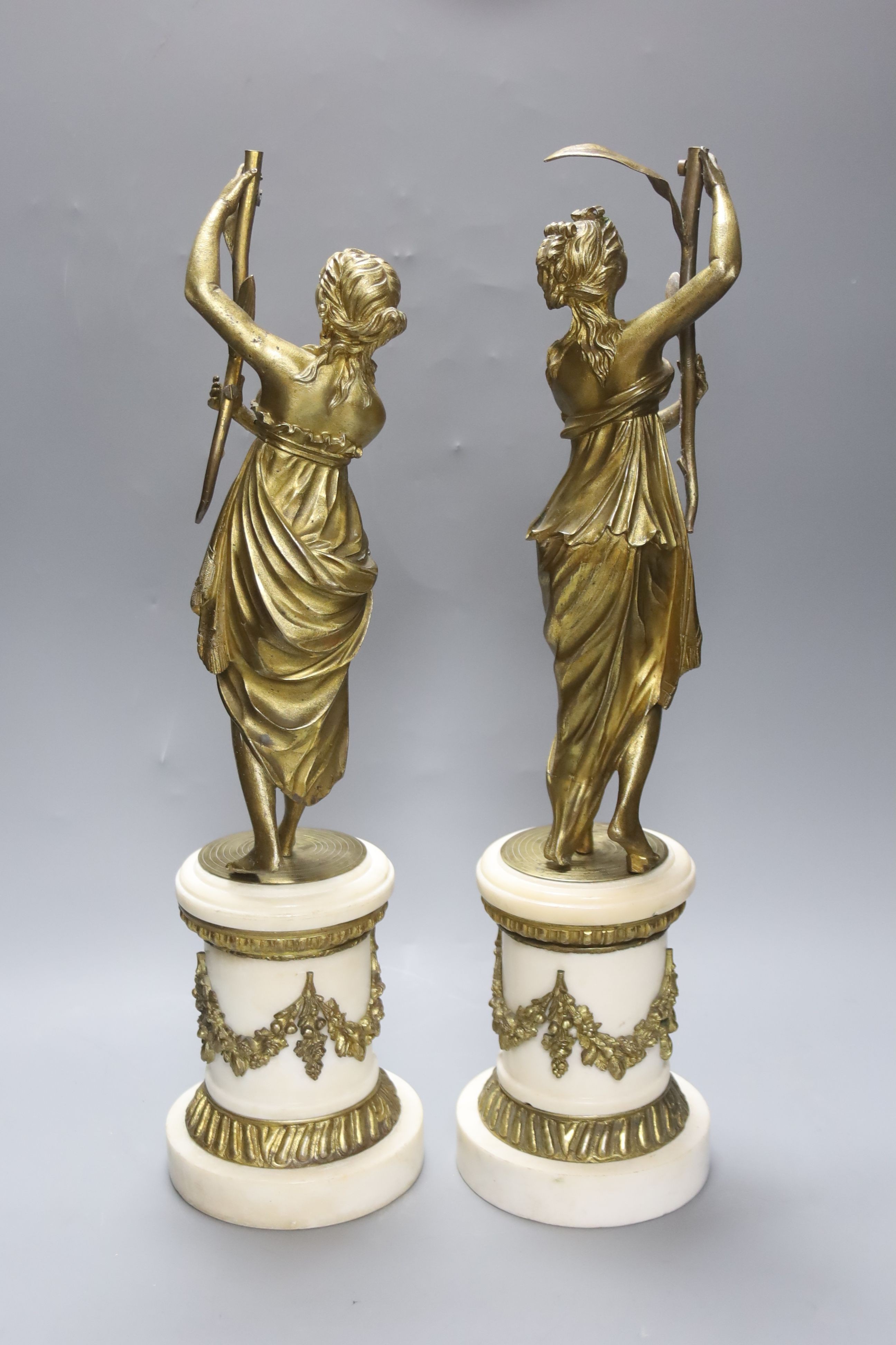 Two French 19th century gilt bronze and white marble figural lamp bases, 47cm